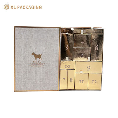 Buy Wholesale Book Shaped Countdown Calendar Gift Box, Magnetic Flip Box with 12 Gold Drawers, Ribbon Pull Tab for Skincare Cosmetics online manufacture