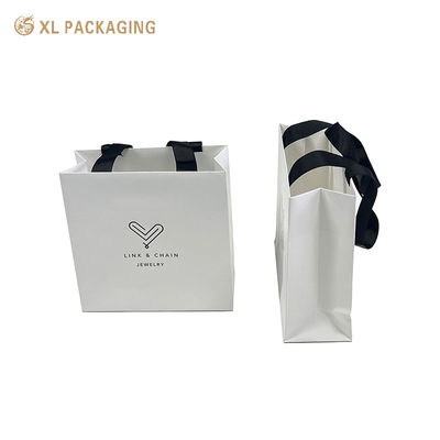 Buy XL Packaging Custom Packaging Factory Customized Luxury Printing Paper Bag Gift Paper Packaging Paper Bag with the Custom Logo Cloth Package Shipping Bag online manufacture