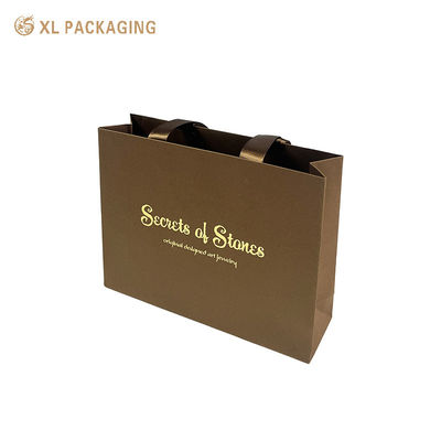 Buy Custom Gold Foil Stamping Kraft Paper Gift Bag with Matte Satin Ribbon Handles and Reinforced Double Fold Edge online manufacture
