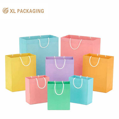 Buy Large recyclable luxury custom logo paper shopping bags with twisted paper handles online manufacture