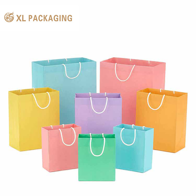 Buy XL Packaing Luxury Custom Logo Brand Large Garments Shopping Paper Bags Clothing Shoes Recyclable Packaging For Men Women Paper Bags With Twisted Paper Handle online manufacture