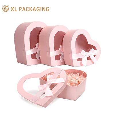 Buy Custom Heart Shape Rigid Gift Box with 2mm Grey Board PET Window and Satin Ribbon Bow for Cosmetic Packaging online manufacture