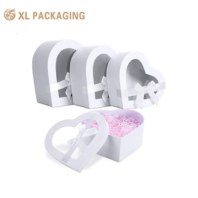 Buy Custom Printed Heart Shape Cosmetic Rigid Box, White Gift Box with Transparent Window and Satin Bow online manufacture