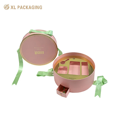 Buy Custom Luxury Boxes WholesalRound Cosmetic Paper Box With Unique Design Mini Drawer Box Green Ribbon Handle And Gold Tray For Beauty Essentials online manufacture