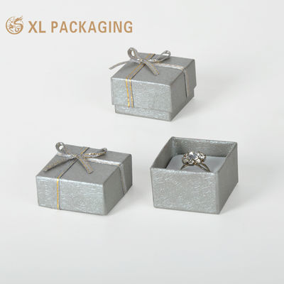 Buy Custom Silver-Grey Embossed Rigid Ring Jewelry Box with Velvet-Wrapped Insert and Silver Ribbon Bow online manufacture