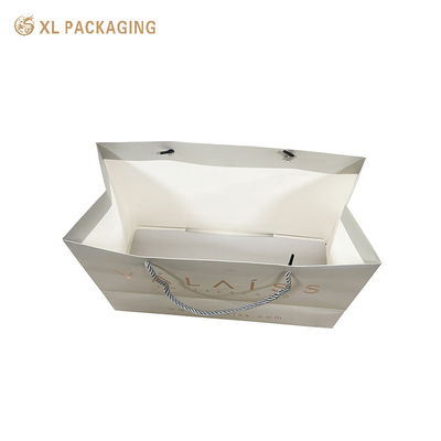 Custom 250Ggsm Art Paper Luxury Shopping Bags with Matte Lamination and Reinforced Handles for Premium Retail Packaging