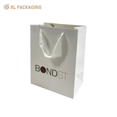 Premium 250gsm Thick Art Paper Shopping Bags with White Ribbon Handles and Custom CMYK Printing for Luxury Gift Packaging