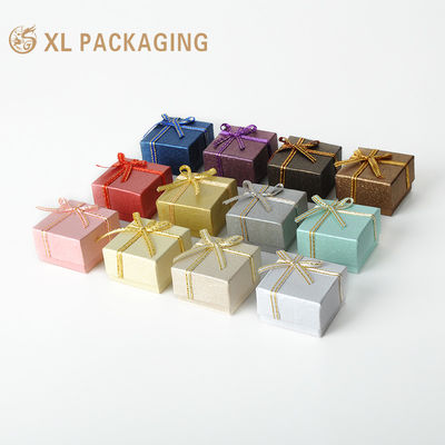 Wholesale Bow Decorated Jewelry Box with 1000gsm Paperboard and 120gsm Textured Paper for Rings & Earrings